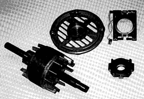 A centrifugal switch removed from its end plate. The flyweight mechanism has also been removed from the motor shaft. 